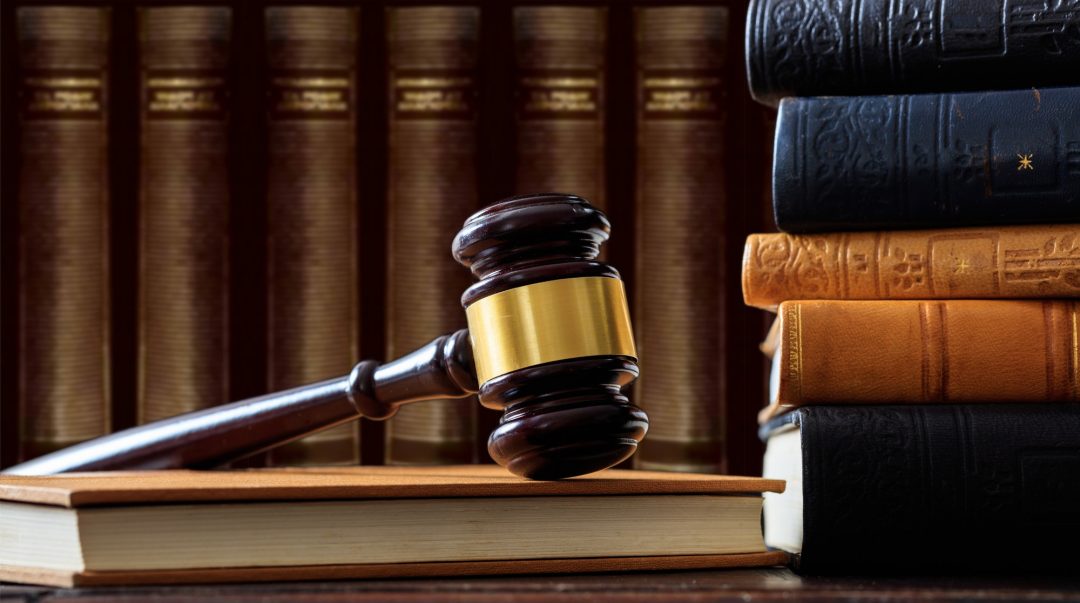 judge-gavel-on-a-book-law-books-background-wooden-desk-e1622361337922.jpg